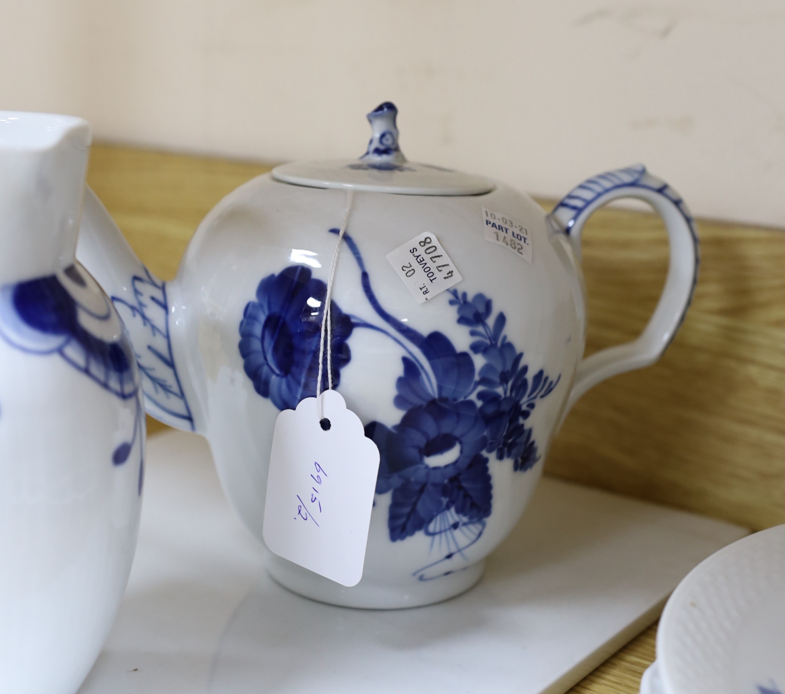 A collection of varying patterns of Royal Copenhagen blue and white tableware
